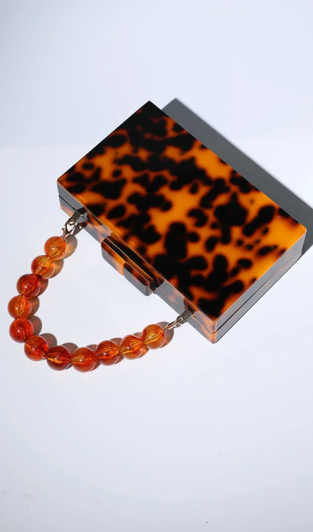 ACRYLIC BEADED CLUTCH IN AMBER Gloria Lanvin