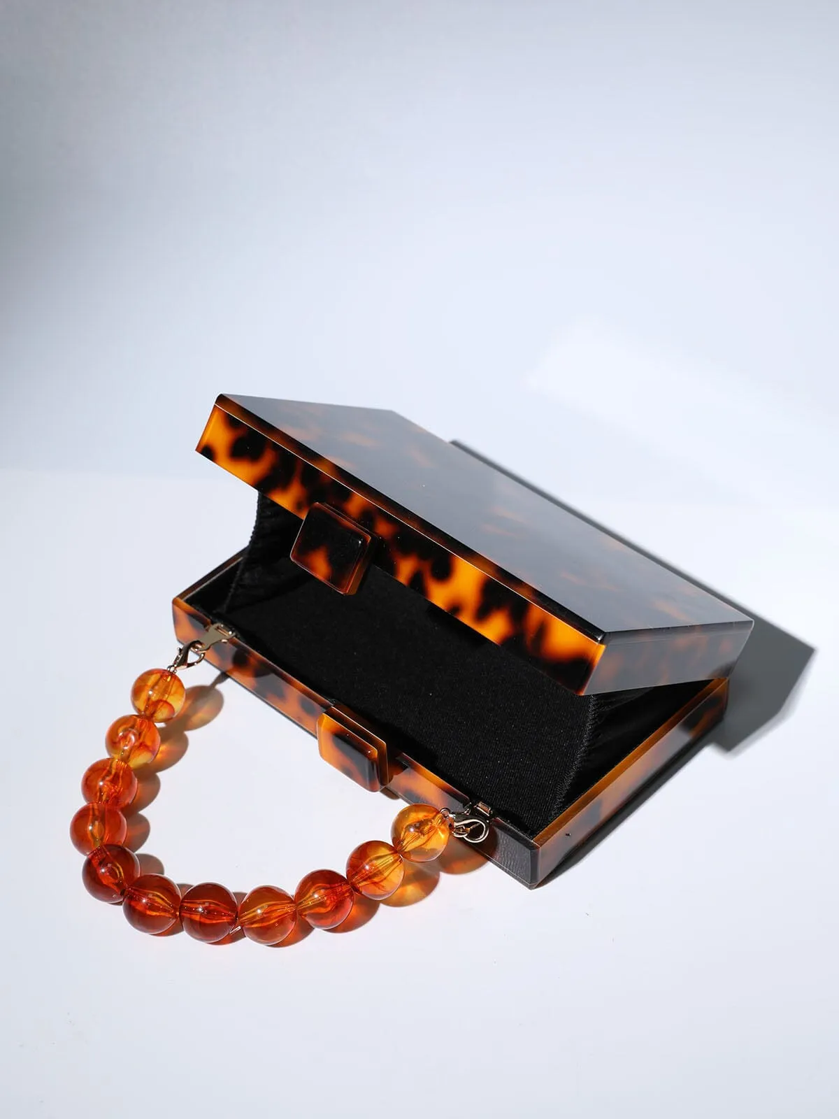 ACRYLIC BEADED CLUTCH IN AMBER Gloria Lanvin