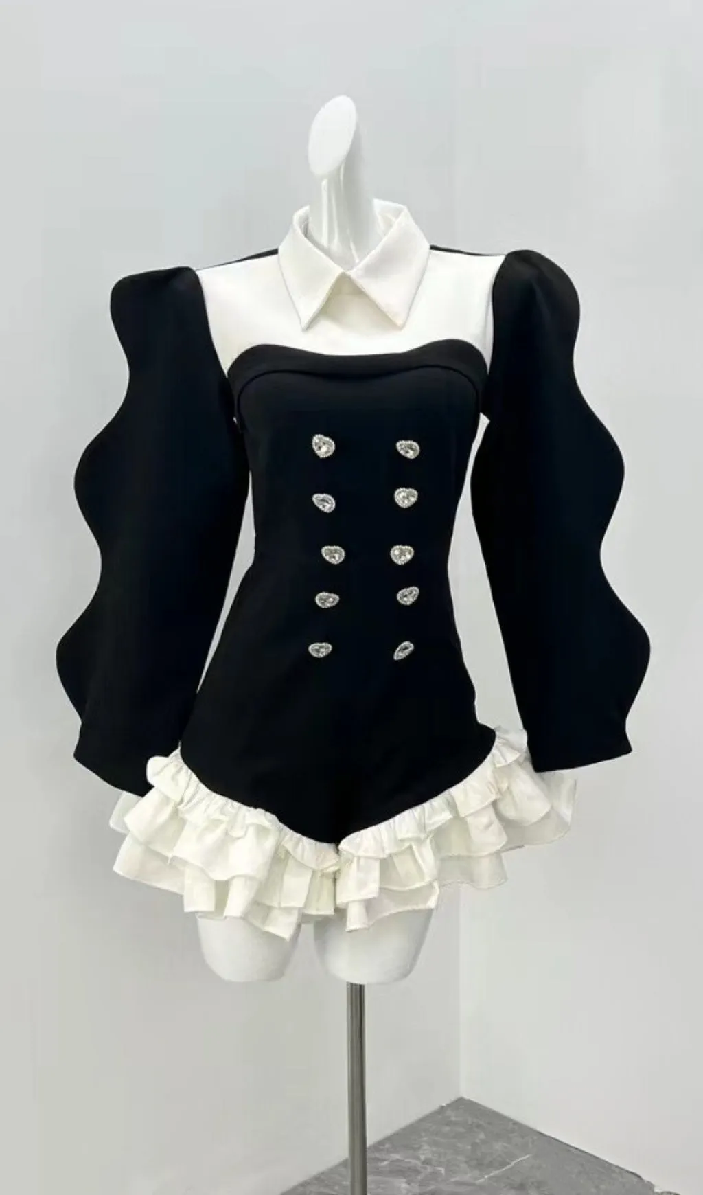 SUIT COLLAR RUFFLED HEM JUMPSUIT IN BLACK Gloria Lanvin
